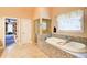 A view of the bathroom featuring a soaking tub, shower and walk in closet at 805 Cog Hl, Mcdonough, GA 30253