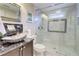 Bathroom featuring a stone sink, granite countertops, and a glass-enclosed shower at 805 Cog Hl, Mcdonough, GA 30253