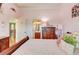 Comfortable bedroom with hardwood floors, a chest of drawers, and a window at 805 Cog Hl, Mcdonough, GA 30253