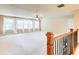 Upstairs bonus room featuring carpet flooring, many windows, and lots of light at 805 Cog Hl, Mcdonough, GA 30253