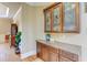 Elegant butler's pantry with custom cabinetry, granite countertops, and ample storage at 805 Cog Hl, Mcdonough, GA 30253