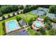 Aerial view of community pool, tennis courts, and outdoor lounge areas at 805 Cog Hl, Mcdonough, GA 30253