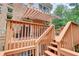 Multi-level deck with seating areas and awning, offering a comfortable outdoor space at 805 Cog Hl, Mcdonough, GA 30253