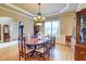 Formal dining room with hardwood floors, a decorative chandelier, and a large window at 805 Cog Hl, Mcdonough, GA 30253