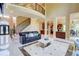 Grand foyer featuring a curved staircase, soaring ceilings, and marble flooring at 805 Cog Hl, Mcdonough, GA 30253