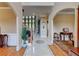 Elegant foyer with polished tile floors, arched doorways, and a graceful staircase at 805 Cog Hl, Mcdonough, GA 30253