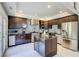 Contemporary kitchen boasts stainless steel appliances, dark cabinets, and a central island at 805 Cog Hl, Mcdonough, GA 30253