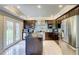 This kitchen has an island, stainless steel appliances, and a door to the backyard, creating a seamless blend of indoor-outdoor living at 805 Cog Hl, Mcdonough, GA 30253