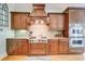 Well-equipped kitchen with stainless steel appliances, wooden cabinets, and granite countertops at 805 Cog Hl, Mcdonough, GA 30253