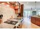 Gourmet kitchen featuring stainless steel appliances, granite countertops, and custom backsplash at 805 Cog Hl, Mcdonough, GA 30253