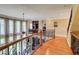Upstairs landing featuring hardwood floors, iron railing, and lots of light at 805 Cog Hl, Mcdonough, GA 30253