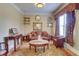 Cozy living room featuring a plush sofa, ornate rug, and decorative accessories at 805 Cog Hl, Mcdonough, GA 30253