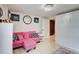 Living room with a pink couch, rug, and white built-in cabinet at 805 Cog Hl, Mcdonough, GA 30253