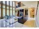 Spacious living room with large windows, a fireplace, and a view of the upper level at 805 Cog Hl, Mcdonough, GA 30253