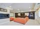 Cozy living area with modern fireplace, built-in entertainment center and access to outdoor patio at 805 Cog Hl, Mcdonough, GA 30253