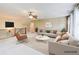 A living room located on an upper floor featuring lots of light, neutral colors, and nice furniture at 805 Cog Hl, Mcdonough, GA 30253