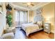 Serene main bedroom with hardwood floors, tray ceiling, and ample natural light at 805 Cog Hl, Mcdonough, GA 30253