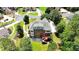 Aerial view of the back exterior, featuring a large yard surrounded by lush greenery in a cul-de-sac at 805 Cog Hl, Mcdonough, GA 30253