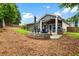 Spacious backyard with a stone patio and seating area, ideal for outdoor entertaining at 132 Berkleigh Trails Dr, Hiram, GA 30141
