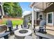 The backyard has a cozy patio area and fire pit, ideal for gathering and relaxing outdoors at 132 Berkleigh Trails Dr, Hiram, GA 30141