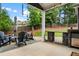 Charming backyard patio with outdoor kitchen, fireplace, and ample seating for entertaining at 132 Berkleigh Trails Dr, Hiram, GA 30141