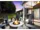 Outdoor patio featuring a fire pit, adirondack chairs, and serene backyard views at 132 Berkleigh Trails Dr, Hiram, GA 30141