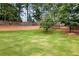 Lush backyard offers privacy and plenty of room for outdoor activities with a wooded border at 132 Berkleigh Trails Dr, Hiram, GA 30141