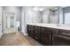 Large bathroom features double sinks, dark cabinetry, walk in shower and a soaking tub at 132 Berkleigh Trails Dr, Hiram, GA 30141