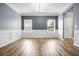 Charming dining room with hardwood floors, decorative trim, and modern chandelier at 132 Berkleigh Trails Dr, Hiram, GA 30141