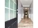 Light and airy hallway with hardwood floors, white trim, and neutral paint at 132 Berkleigh Trails Dr, Hiram, GA 30141