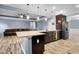 Spacious kitchen with an island bar overlooks the living area with stainless steel appliances at 132 Berkleigh Trails Dr, Hiram, GA 30141