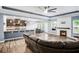 Open-concept living area with a fireplace, kitchen view, and dining space for entertaining at 132 Berkleigh Trails Dr, Hiram, GA 30141