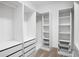 Custom walk-in closet with built-in shelving and drawers for optimal organization at 132 Berkleigh Trails Dr, Hiram, GA 30141