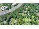 Aerial view showcasing the property line, nearby highway and surrounding neighborhood at 1970 Fisher Ne Trl, Atlanta, GA 30345