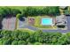 A nice aerial view of the community amenities including the tennis court and pool at 1970 Fisher Ne Trl, Atlanta, GA 30345