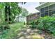 Expansive backyard showing brick home with screened in porch and an adjacent white home at 1970 Fisher Ne Trl, Atlanta, GA 30345