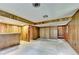 View of paneled basement showcasing an open layout with neutral carpet and access to rooms at 1970 Fisher Ne Trl, Atlanta, GA 30345