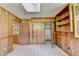 Basement with a checkered tile floor, wood-paneled walls, and an open closet space at 1970 Fisher Ne Trl, Atlanta, GA 30345