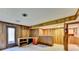 Basement area featuring wood paneling, a built-in bar, and walk-out access to outdoors at 1970 Fisher Ne Trl, Atlanta, GA 30345