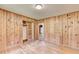 Bedroom featuring knotty pine paneling, hardwood floors, and closet at 1970 Fisher Ne Trl, Atlanta, GA 30345