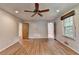 Bright bedroom featuring hardwood floors, neutral walls, a ceiling fan, and lots of natural light at 1970 Fisher Ne Trl, Atlanta, GA 30345
