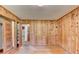 Bedroom featuring knotty pine paneling, hardwood floors, and closet at 1970 Fisher Ne Trl, Atlanta, GA 30345