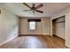 Spacious bedroom features hardwood floors, a ceiling fan, and natural light from a window at 1970 Fisher Ne Trl, Atlanta, GA 30345