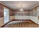 Elegant dining room with patterned wallpaper, chandelier, and traditional trim at 1970 Fisher Ne Trl, Atlanta, GA 30345