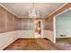 Elegant dining room with patterned wallpaper, chandelier, and traditional trim at 1970 Fisher Ne Trl, Atlanta, GA 30345
