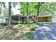 Charming brick home with attached carport and a delightful screened-in porch at 1970 Fisher Ne Trl, Atlanta, GA 30345