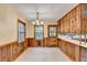Bright kitchen featuring wood cabinets, tiled floors, and natural light from large windows at 1970 Fisher Ne Trl, Atlanta, GA 30345