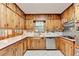 Traditional kitchen featuring knotty pine cabinetry and neutral countertops at 1970 Fisher Ne Trl, Atlanta, GA 30345