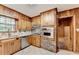 View of the kitchen featuring stainless steel appliances, white counters, and an oven set in a brick column at 1970 Fisher Ne Trl, Atlanta, GA 30345