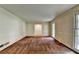 Spacious living room with classic wall paneling, carpet flooring, and view to the front entry at 1970 Fisher Ne Trl, Atlanta, GA 30345